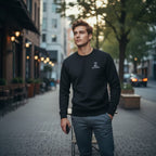 Man wearing a black sweater with a logo on a city street